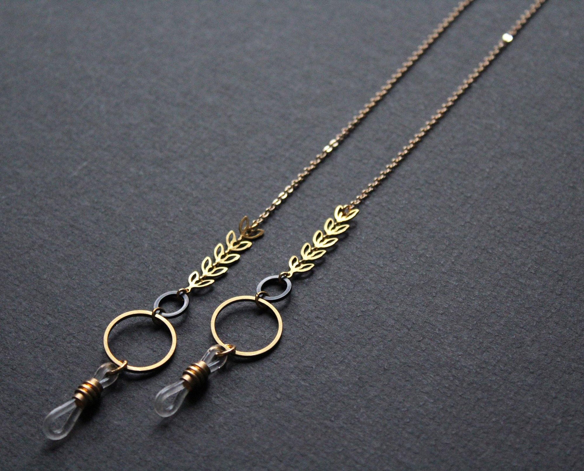 stylish glasses chain, gold and black with metal leaves, handmade Nea Jewelry