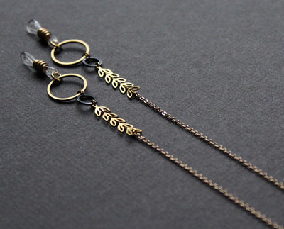 stylish glasses chain, gold and black with metal leaves, handmade Nea Jewelry