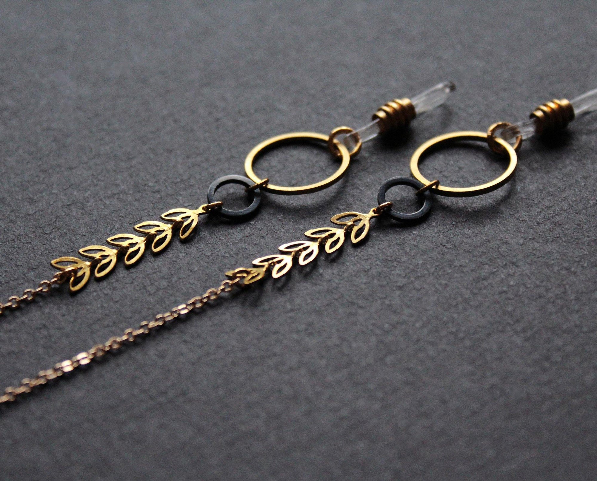 stylish glasses chain, gold and black with metal leaves, handmade Nea Jewelry